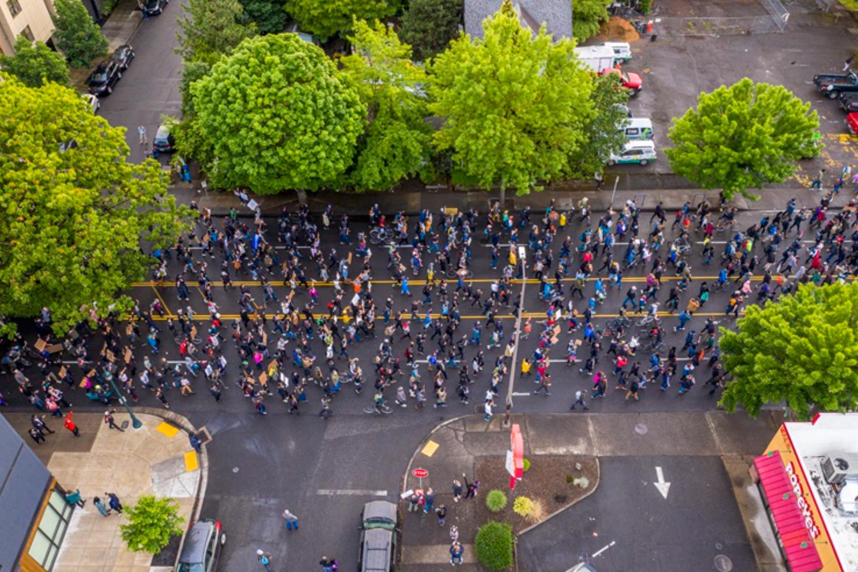 Portlandrone aerial view of protesters marching down Martin Luther King Jr. Boulevard in Portland, Oregon.