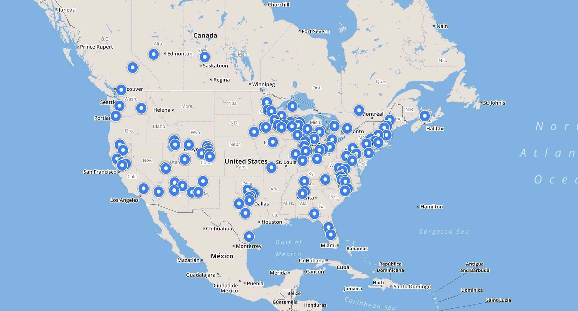Map of North America dotted with blue markers for drone-assisted rescue reports.