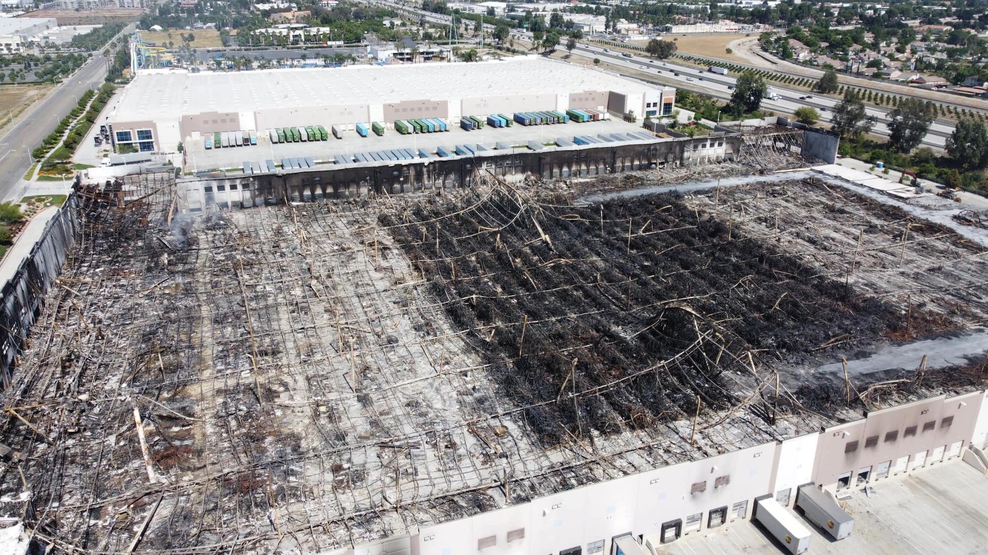 Drone image showing fire damage to the Amazon distribution center in Redlands, California.