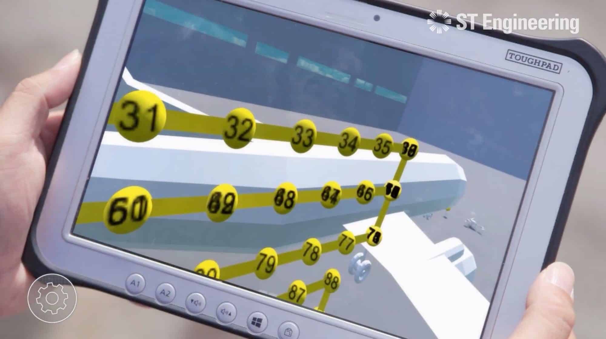 Rugged tablet showing numbered inspection waypoints mapped over an aircraft fuselage model.