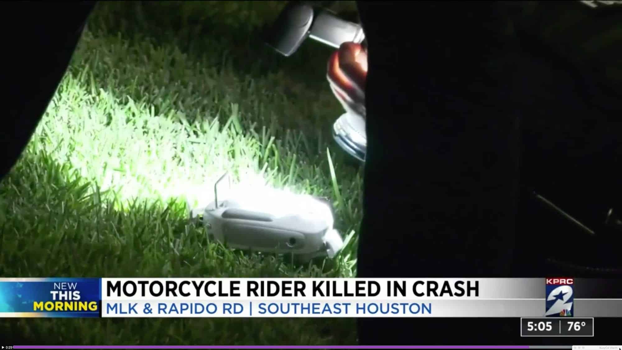 DJI Phantom drone upside down on the pavement after falling onto a Houston police car.