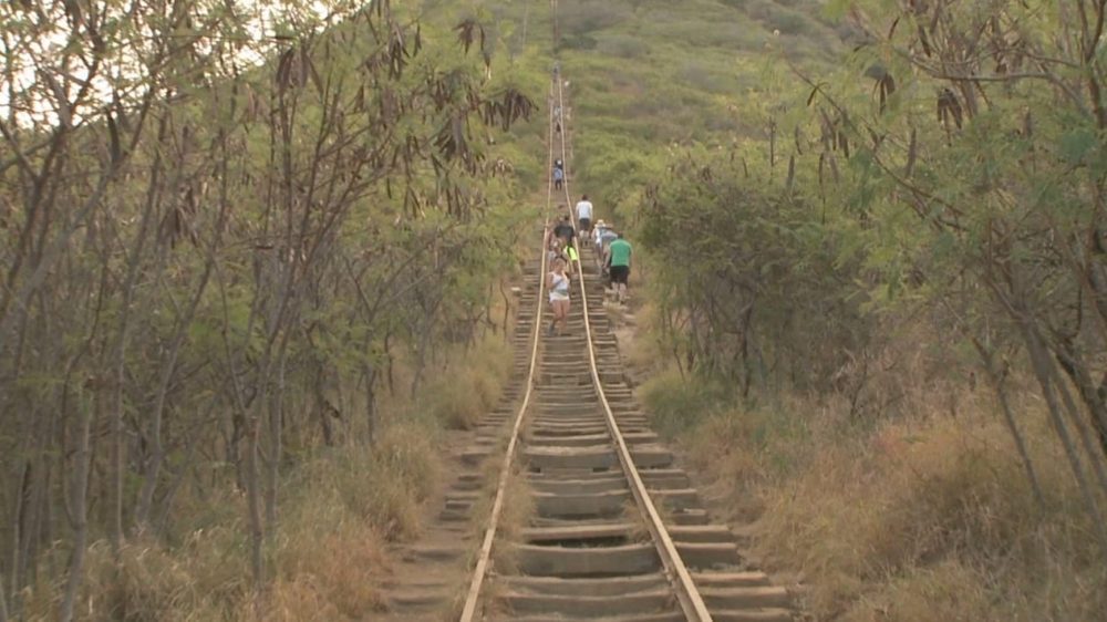 Hikers climb the steep railway-tie stairway leading up Koko Crater in Hawaii.