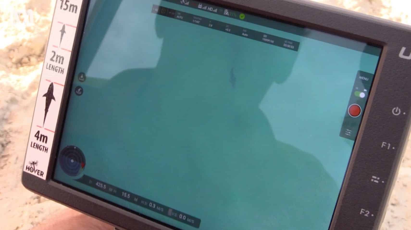 Shark surveillance drone monitoring the water off a New South Wales beach in Australia.
