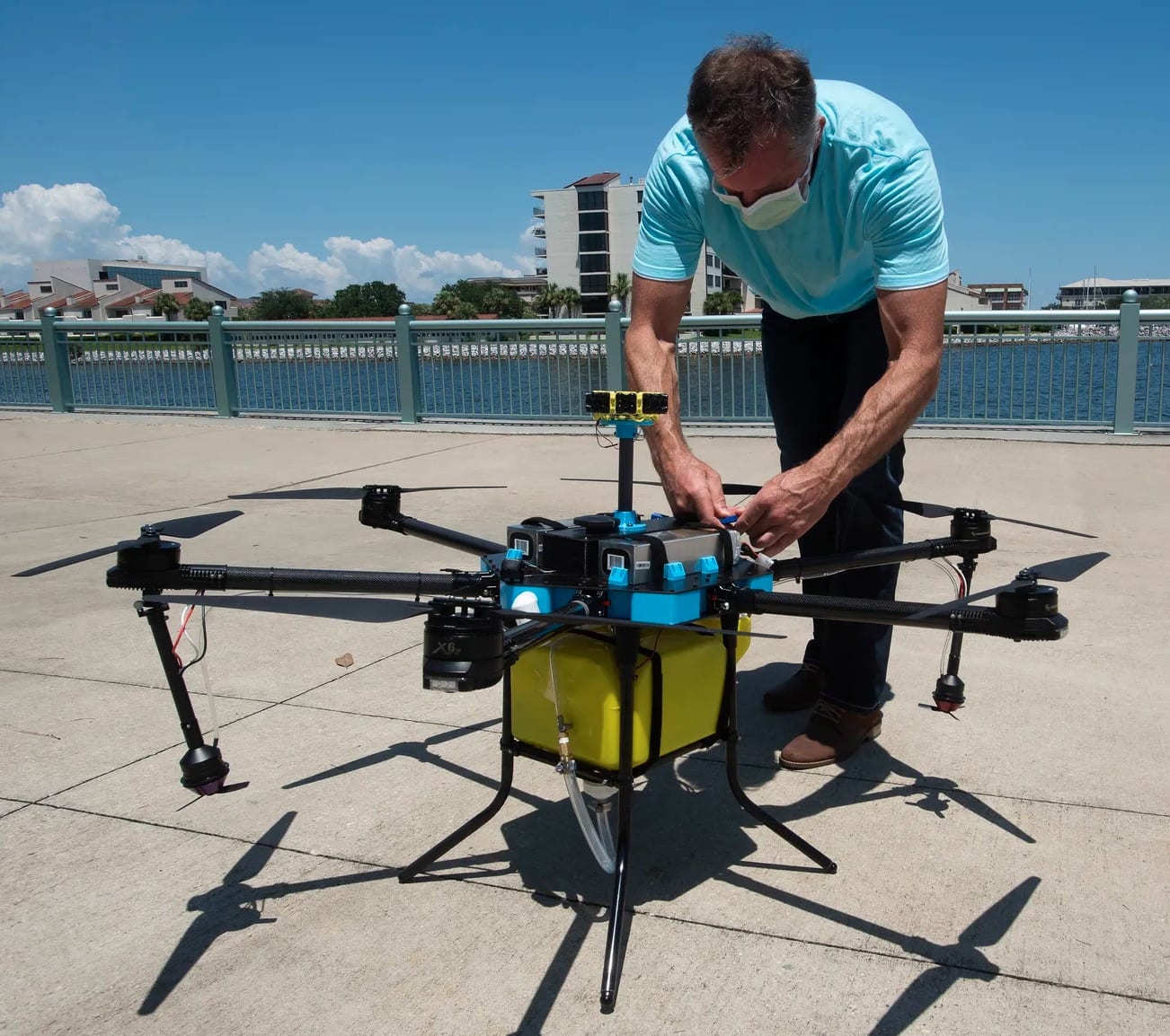 Andy Godfrey, CEO of Upward Drone Solutions, shows his disinfectant-spraying drone.