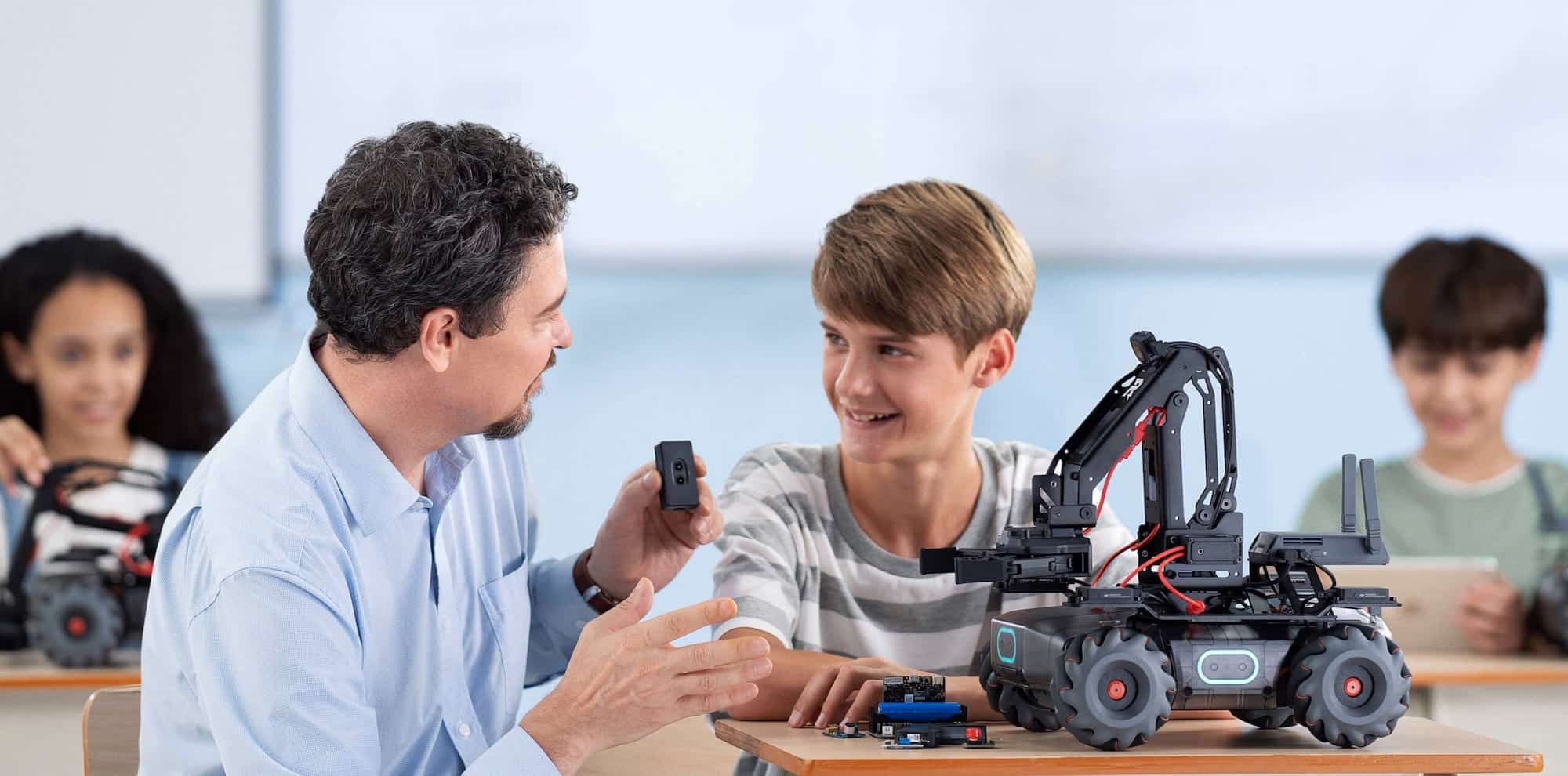 DJI RoboMaster EP Core with programmable sensor modules and mecanum wheels.