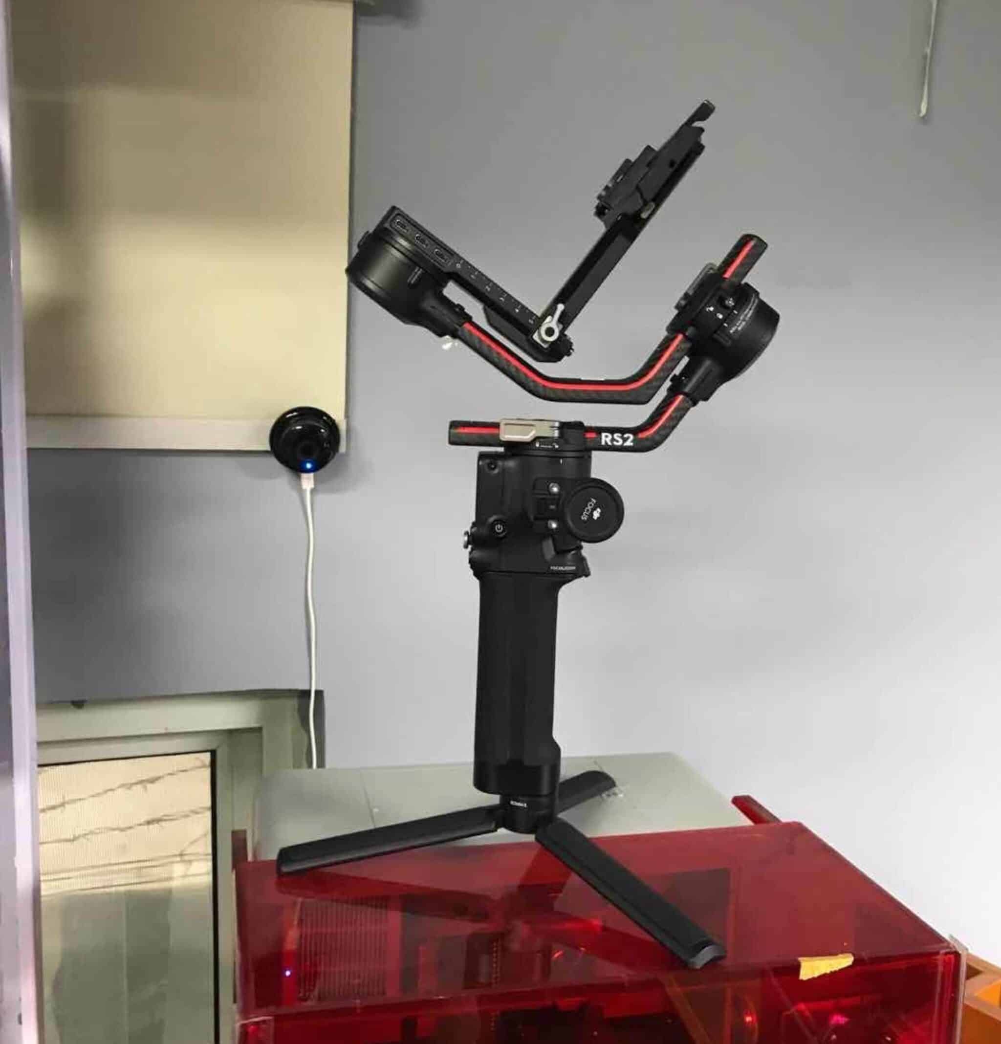 Leaked photo of a DJI Ronin RS2 gimbal holding a camera on a stand.