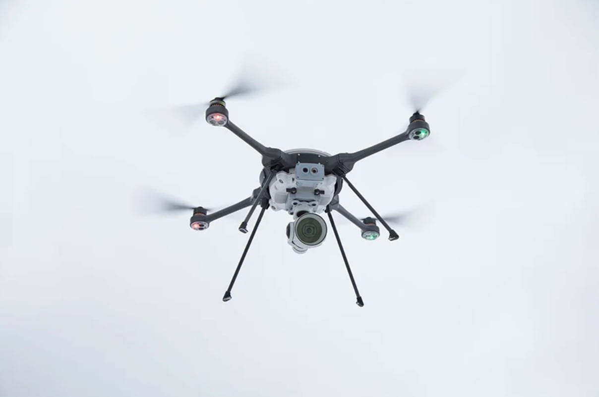 FLIR SkyRanger R70 hexacopter airborne with its sensor ball beneath the fuselage.