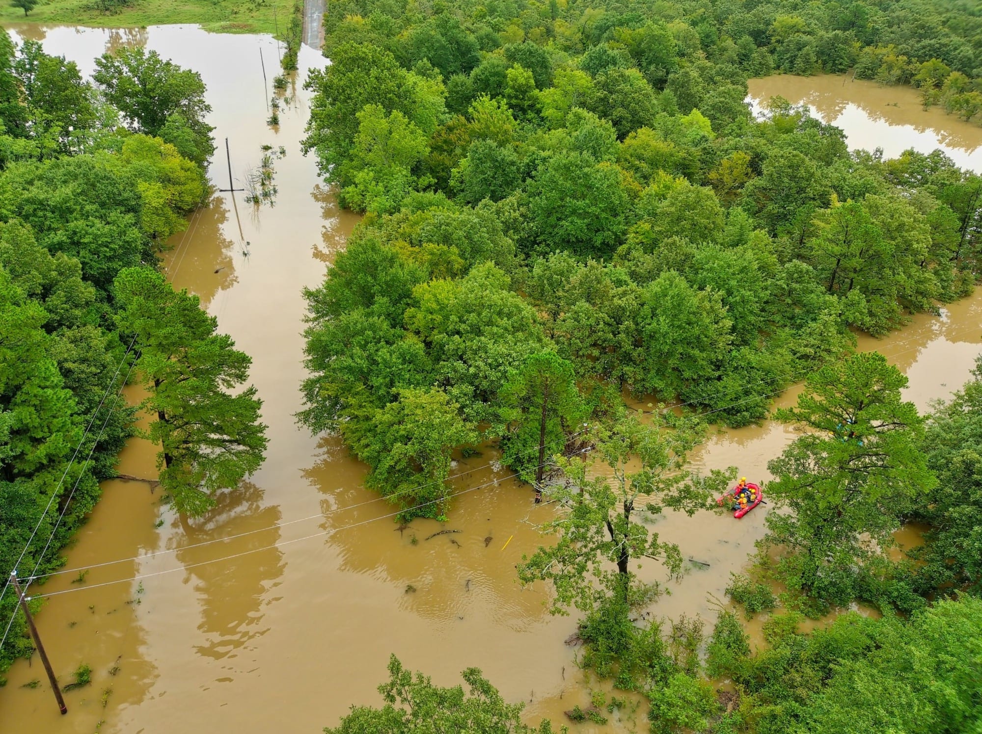 Aerial drone view of floodwaters surrounding the couple's trailer near Albion, Oklahoma.