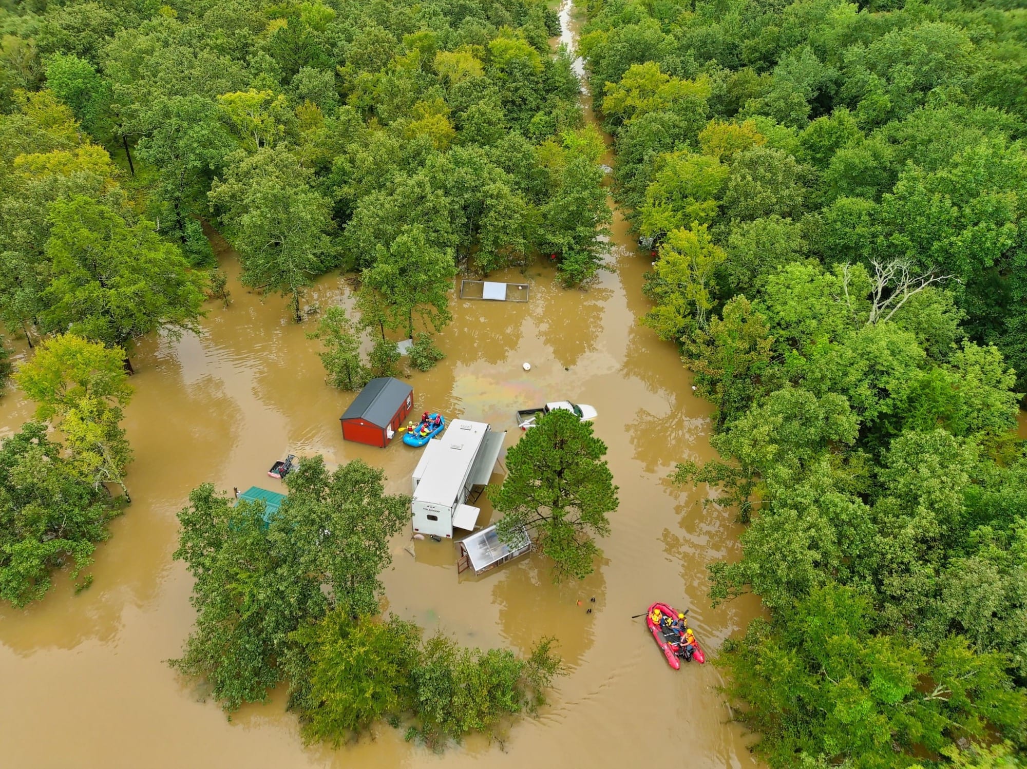 Drone photo showing flash flooding across the Pushmataha County couple's home and property.