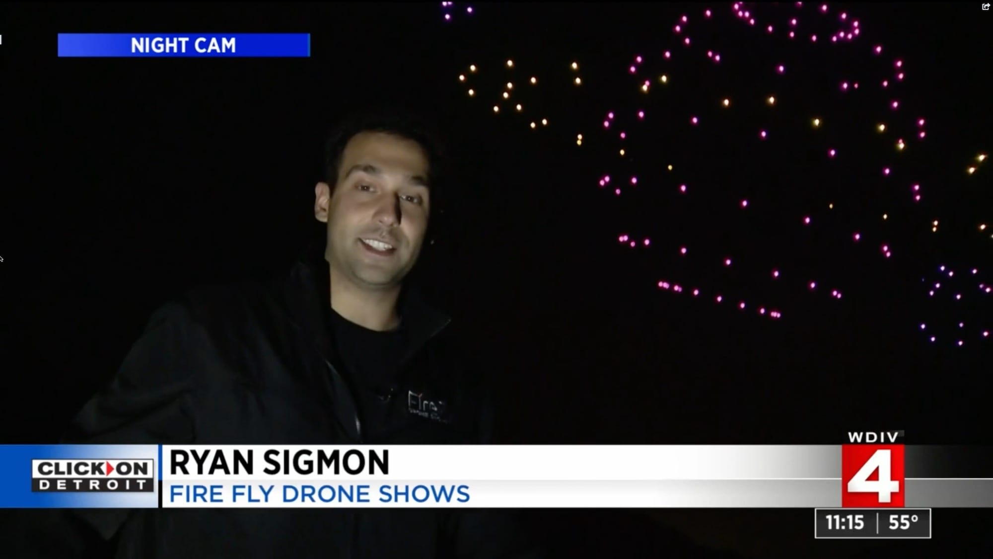 WDIV news interview with Ryan Sigmon of Firefly Drone Shows beside lit show drones.