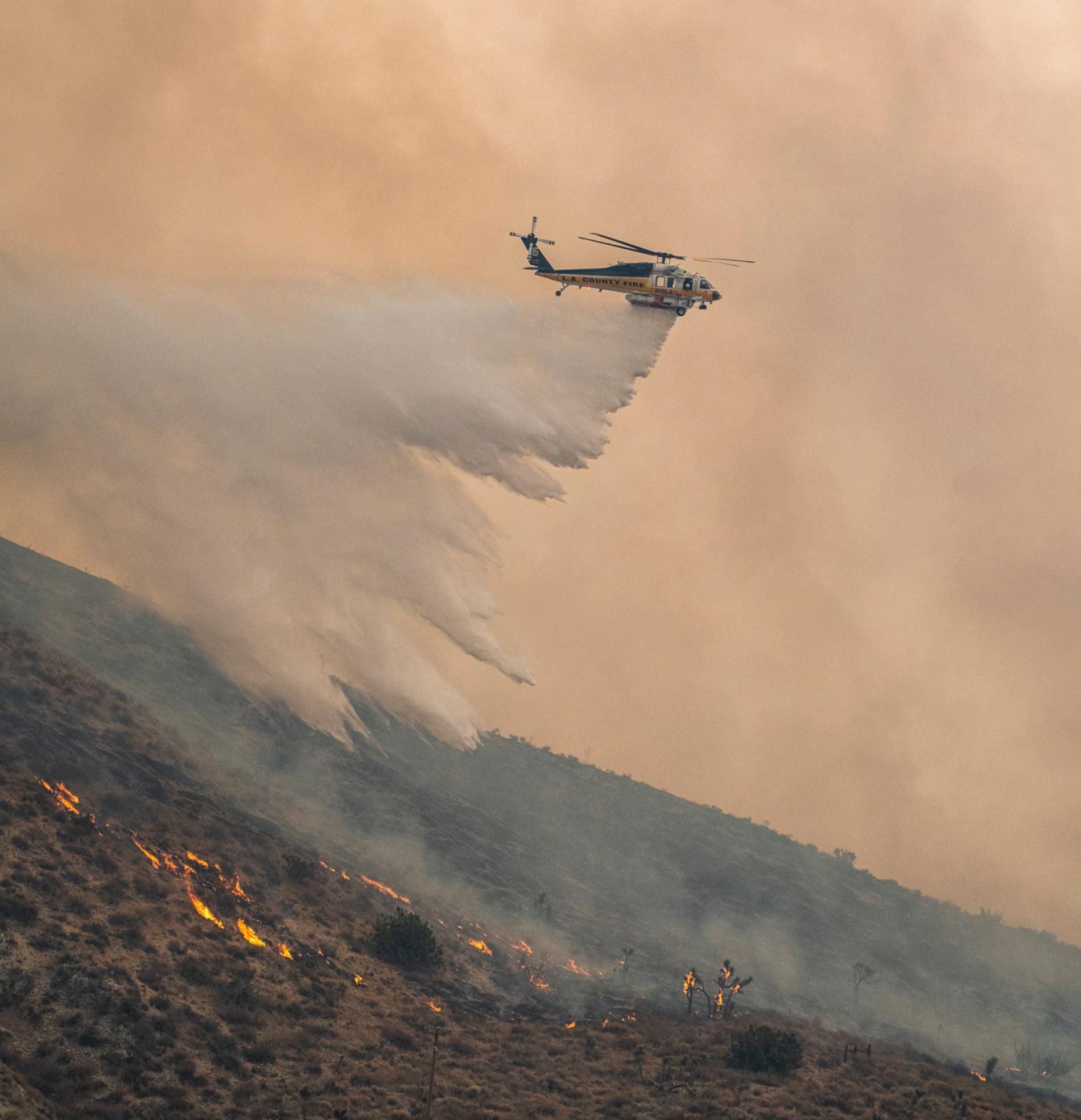 Smoke and low visibility over the fire line, conditions that ground manned aircraft.