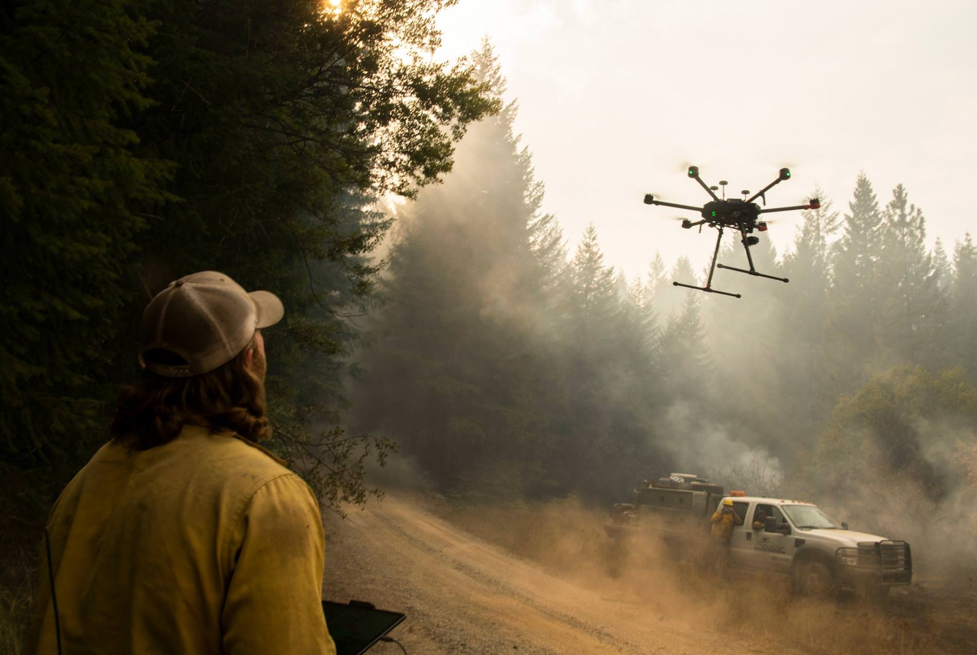 A National Park Service crew launching an unmanned aircraft on a California wildfire.