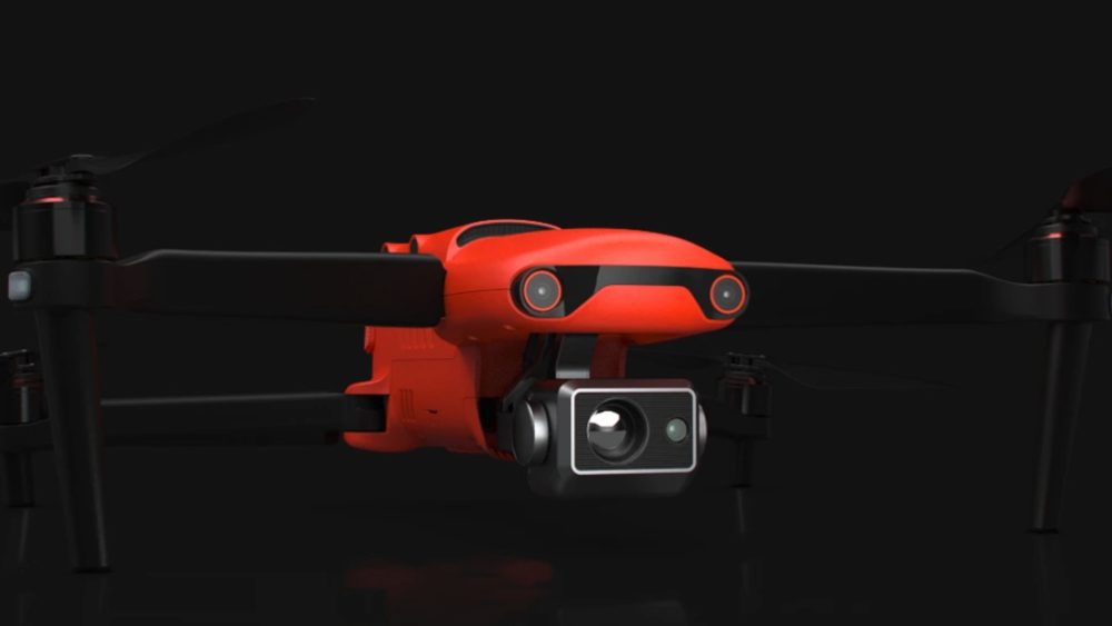 Orange Autel EVO II Dual 640T hovering against a black background.