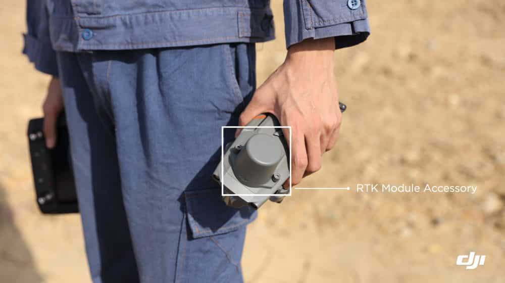 Person carries the Mavic 2 Enterprise Advanced with the RTK module accessory highlighted.