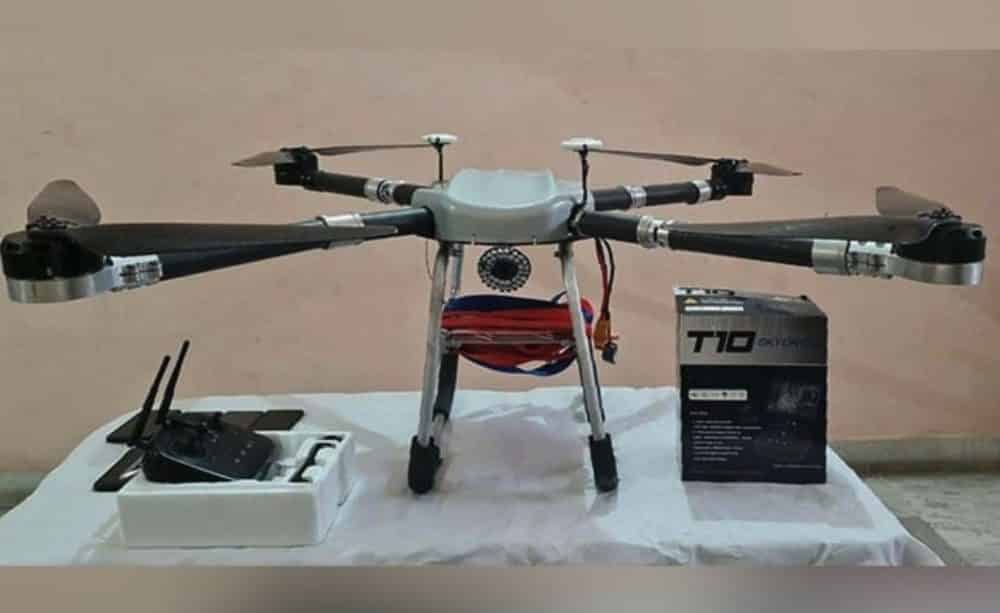 Quadcopter drone and weapons seized by Punjab police from a cross-border smuggling module.