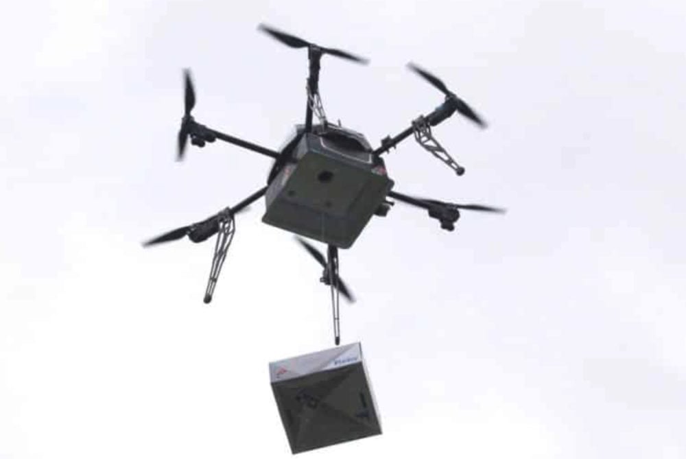 Drone flying over a prison fence, illustrating the rising threat of drug smuggling drones.