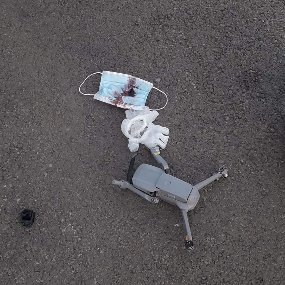 Close view of the shattered cockpit glass where the drone struck.