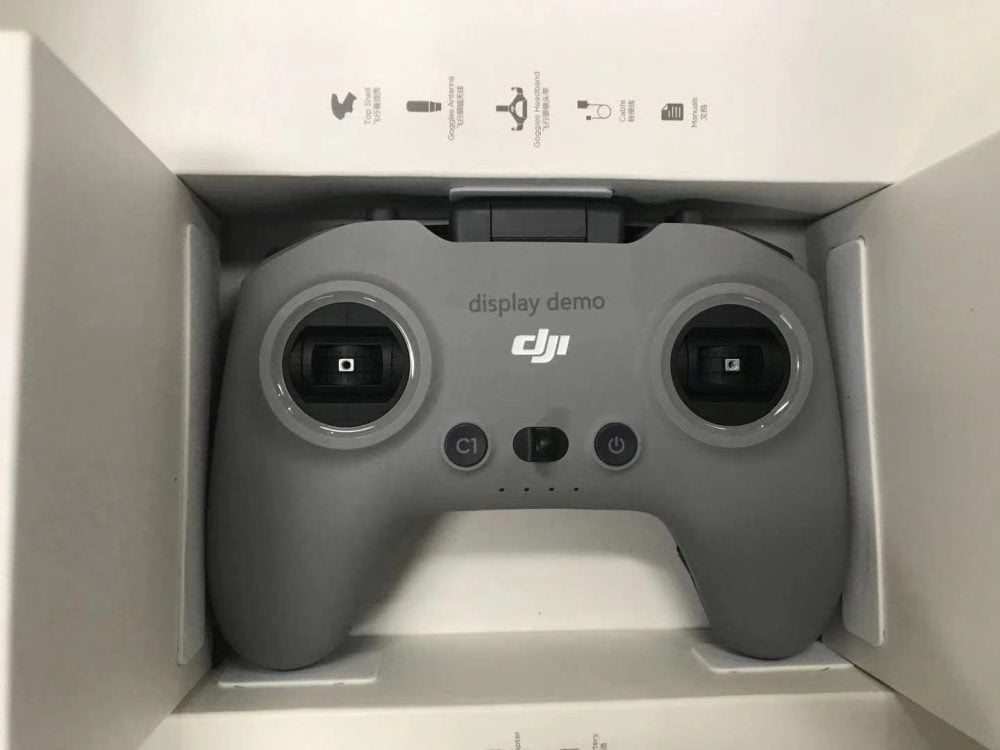 The DJI FPV remote controller sitting in its retail box, marked as a display demo.