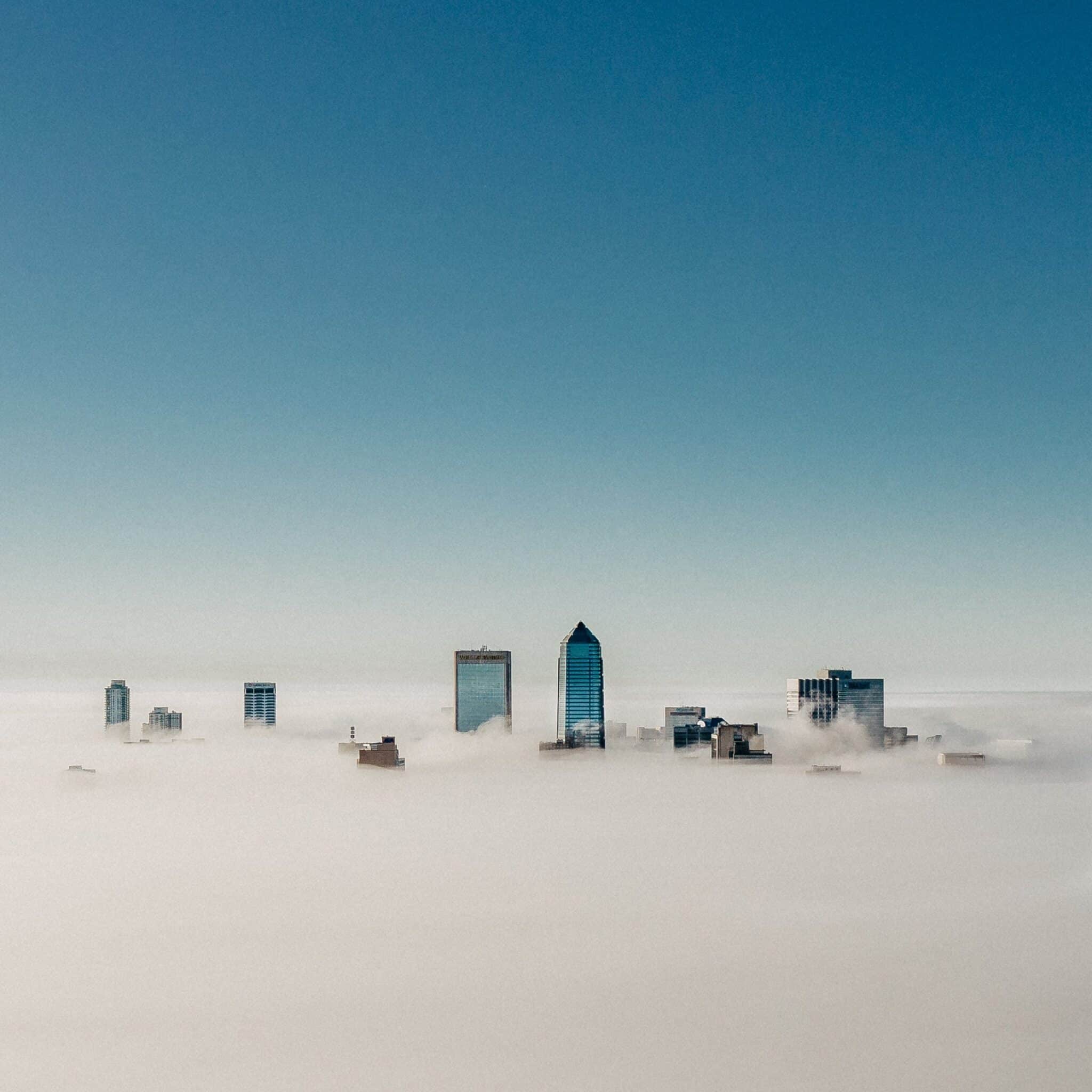 Jacksonville skyscrapers rising above a layer of fog, photographed by drone by Seth Langner.
