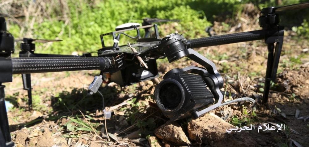 The downed aircraft showing DJI branding on its props, sensor and connector.