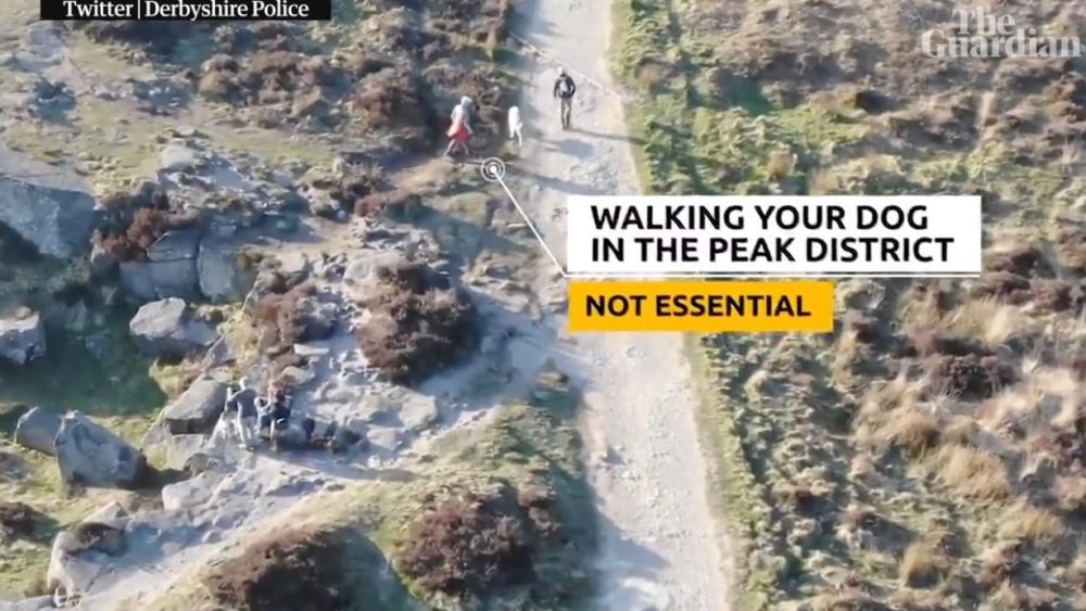 Police drone footage of walkers captioned as non-essential travel in the Peak District.