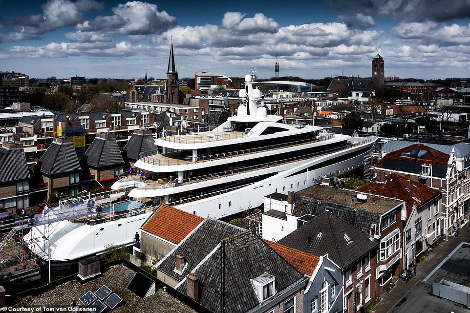 The 308-foot (94-meter) Viva easing through a narrow Dutch canal.