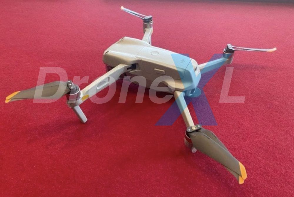 The DJI Air 2S folded up next to its remote controller.