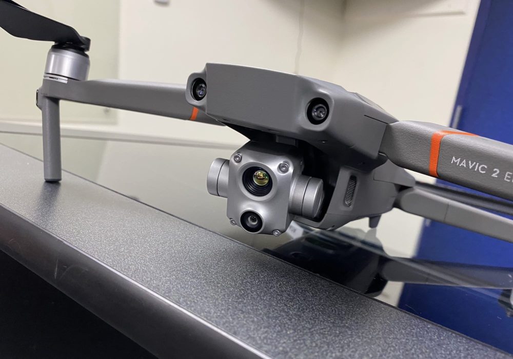 DJI Mavic 2 Enterprise Advanced on a desk showing its thermal and visual cameras.