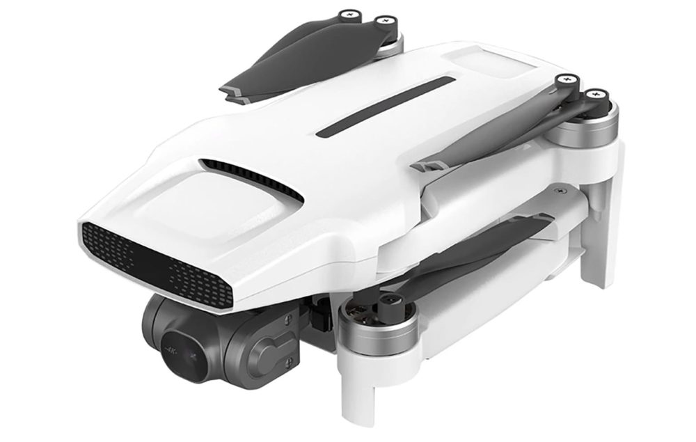 White Fimi X8 Mini folding drone shown from above on plain background.