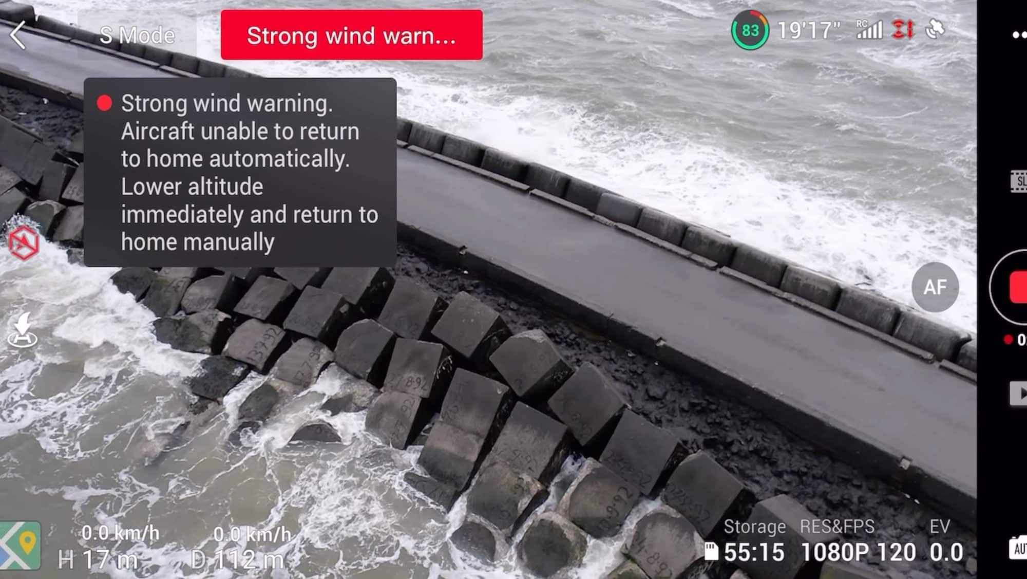 Screenshot of a strong wind warning over choppy water during a flight test.