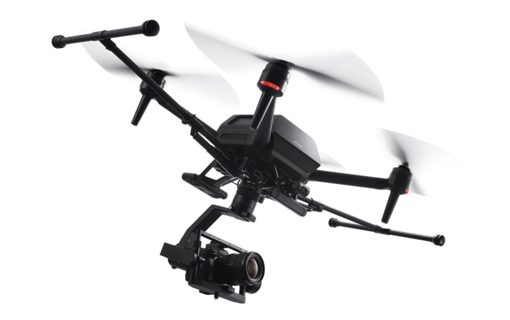Close view of an Airpeak S1 brushless motor and carbon propeller arm.