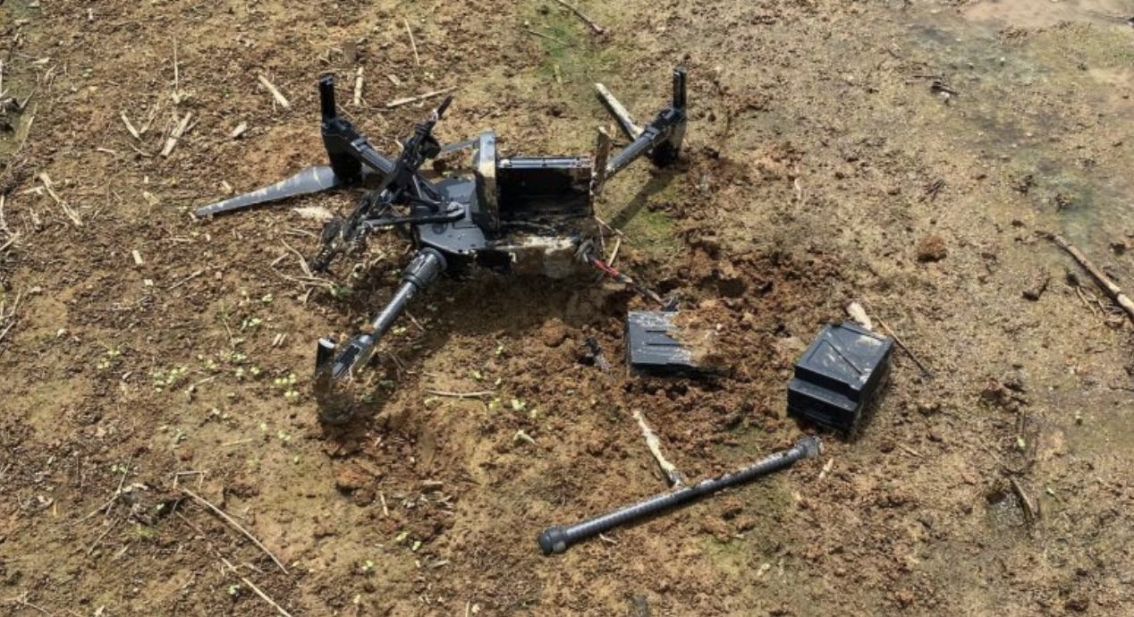 Archive photo of a wrecked DJI Matrice quadcopter lying on the ground.