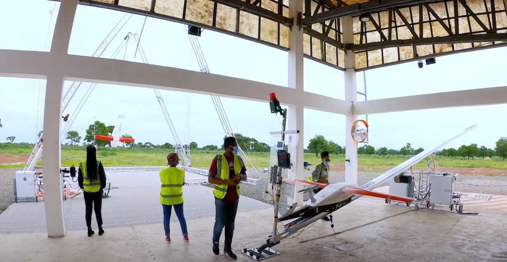 Zipline fixed-wing delivery drone launching from a distribution center in Ghana.