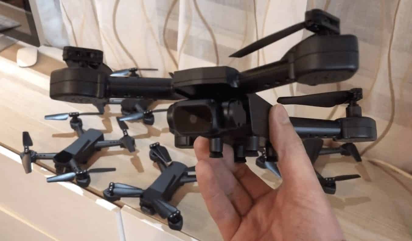 Hand holding the pre-production Micro Drone 4.0 with folded arms.
