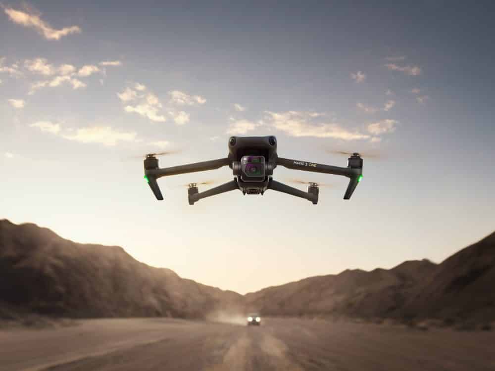 The DJI Mavic 3 flying above canyon and mountain terrain.