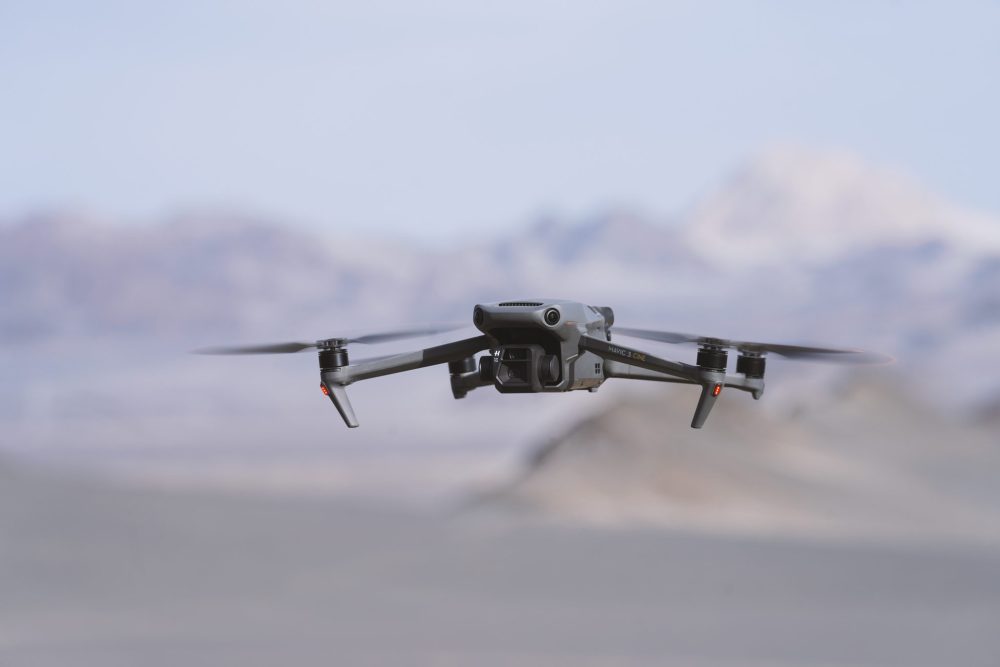 DJI Mavic 3 shown against a canyon backdrop in official imagery.