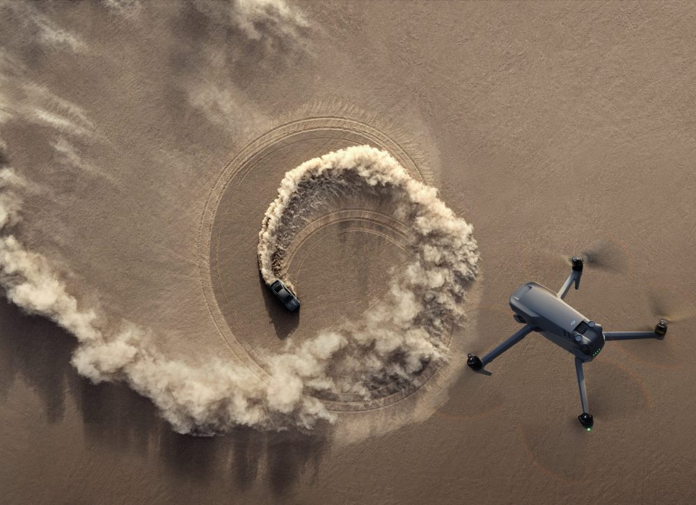 DJI key visual of the Mavic 3 hovering over desert landscape.