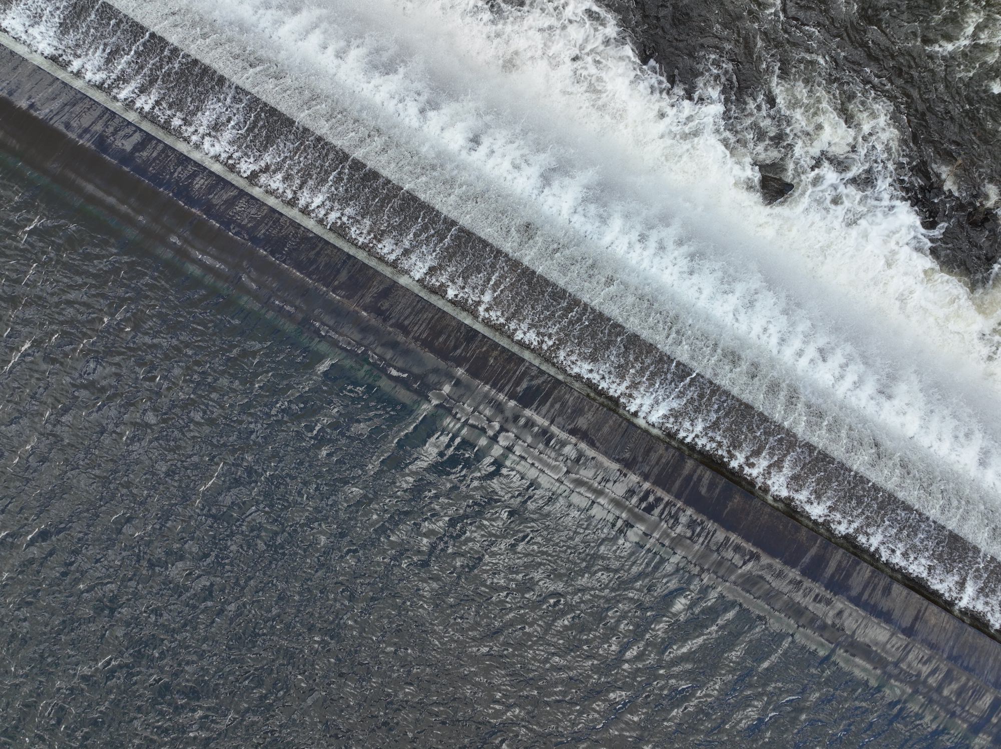 Unedited Mavic 3 frame showing shadow detail across wooded terrain.