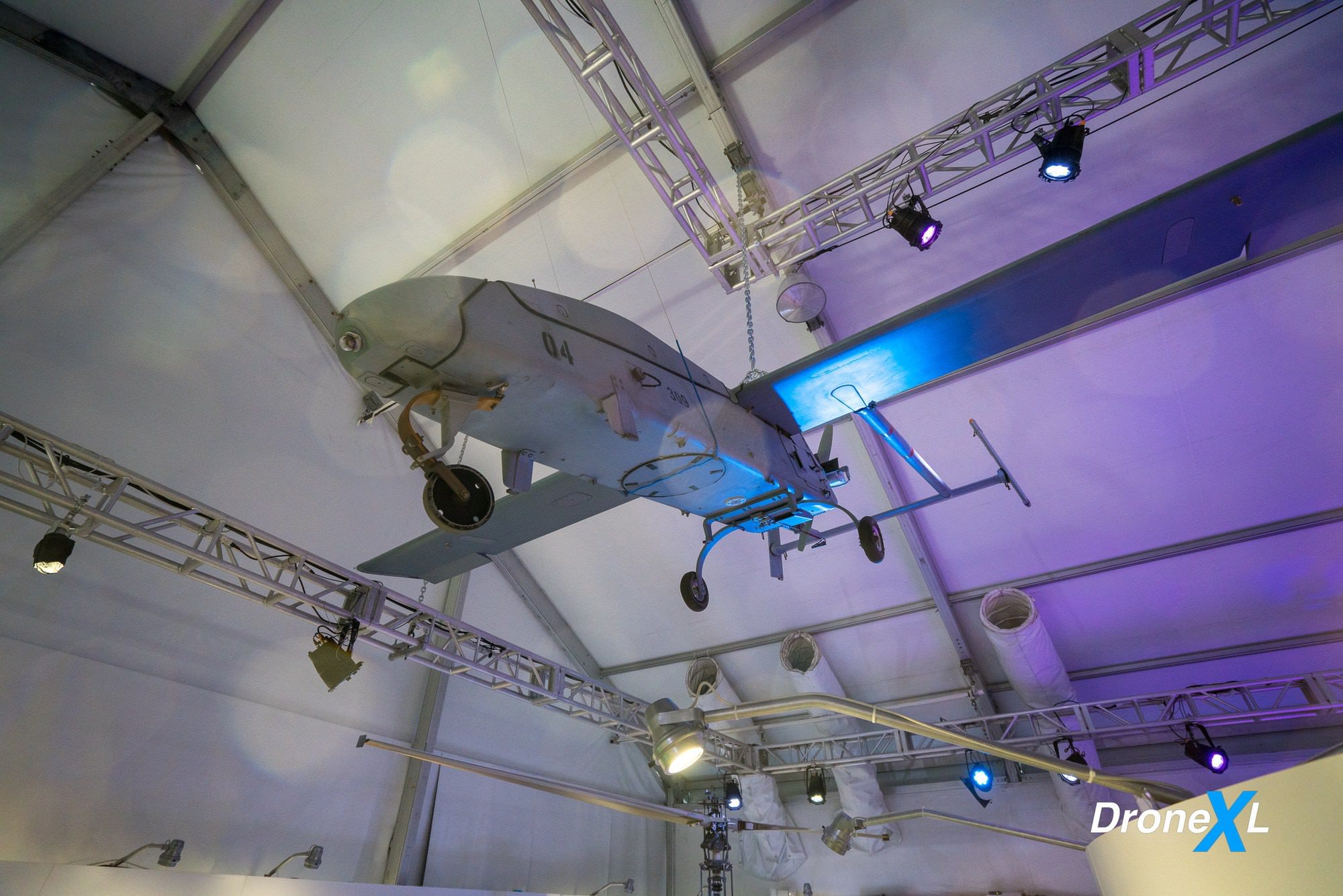 Exhibit text on backpack-sized surveillance drones launched by soldiers during battle.