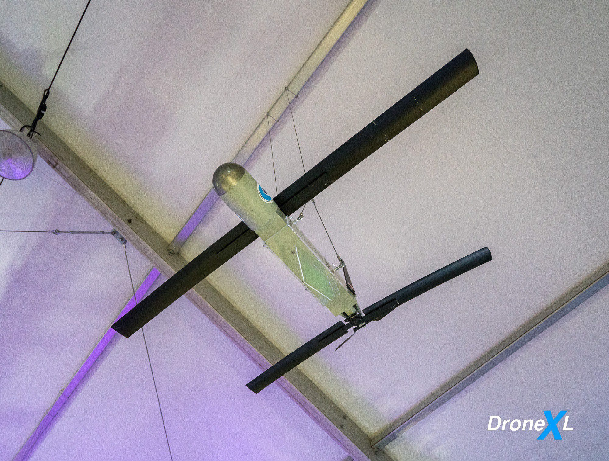 Tracking Hurricanes panel on NOAA dropping Coyote drones into low-altitude storm zones.