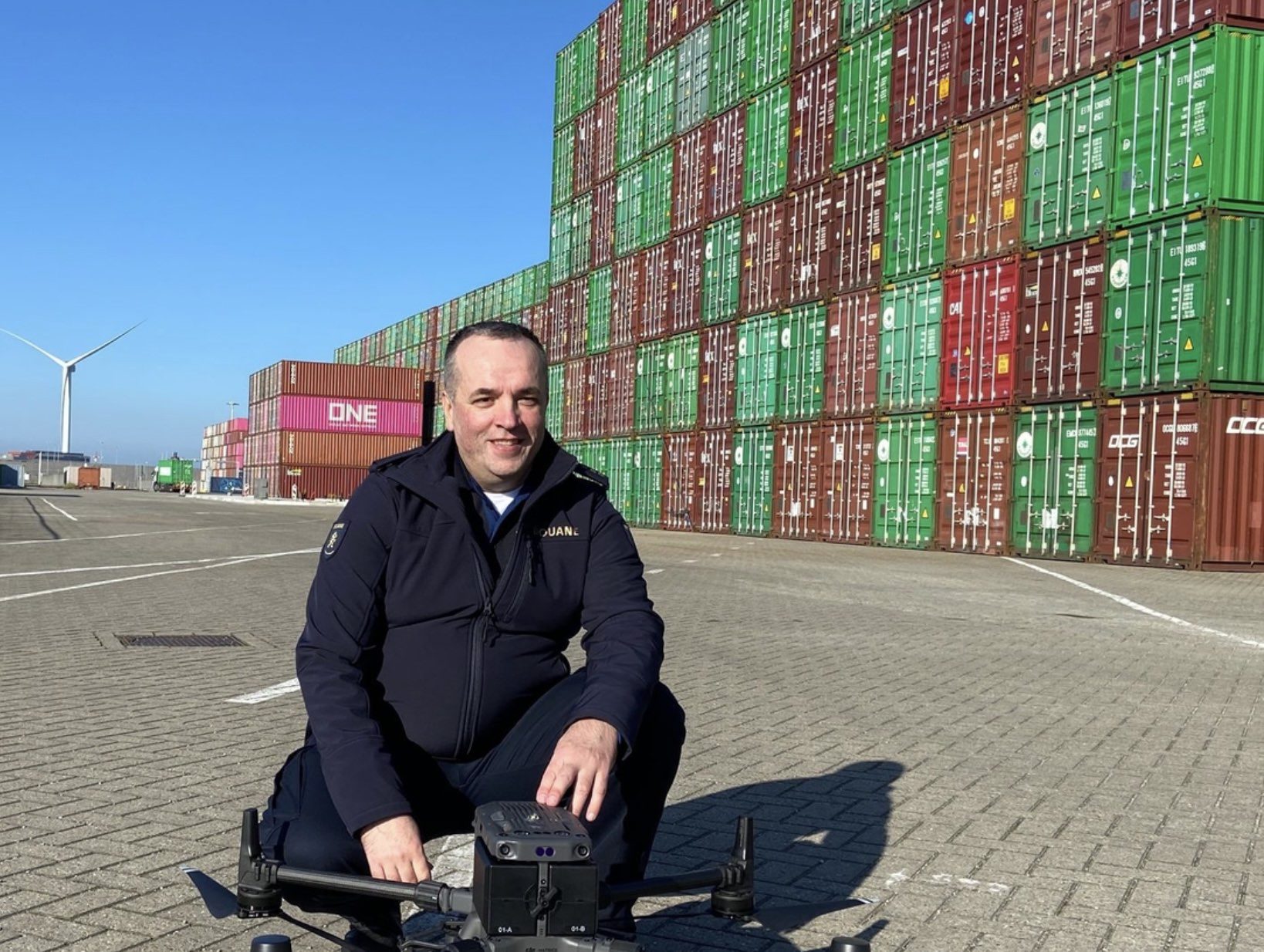 A customs drone pilot at work during aerial surveillance in the port of Rotterdam.