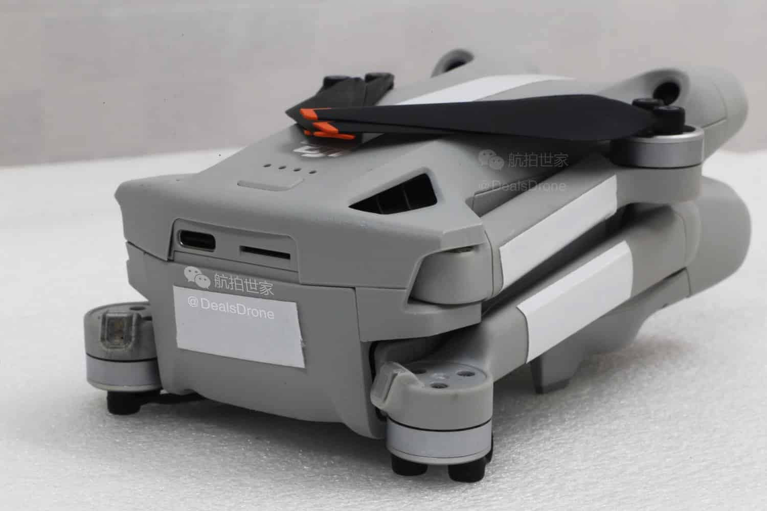Folded Mini 3 Pro showing how the front arms rotate and swing backward.