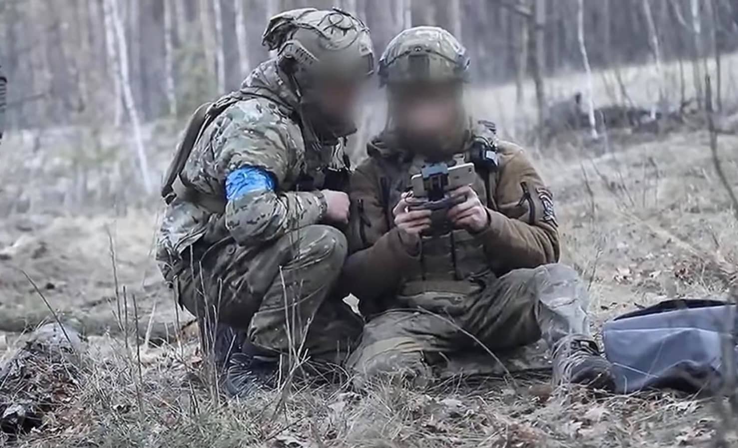 A Ukrainian serviceman preparing a DJI quadcopter for a reconnaissance flight.