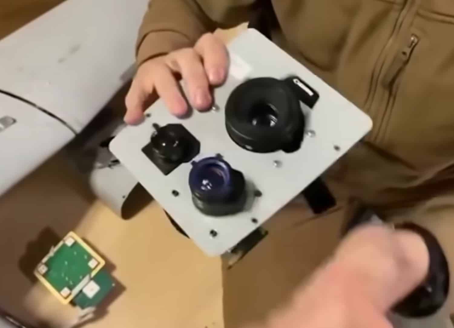 A video released by Ukraine's Ministry of Defense shows a Ukrainian soldier taking apart a Russian military drone, called the Orlan-10. The surveillance aircraft features a low-end Canon camera, duct tape, and a bottle top for a fuel cap.