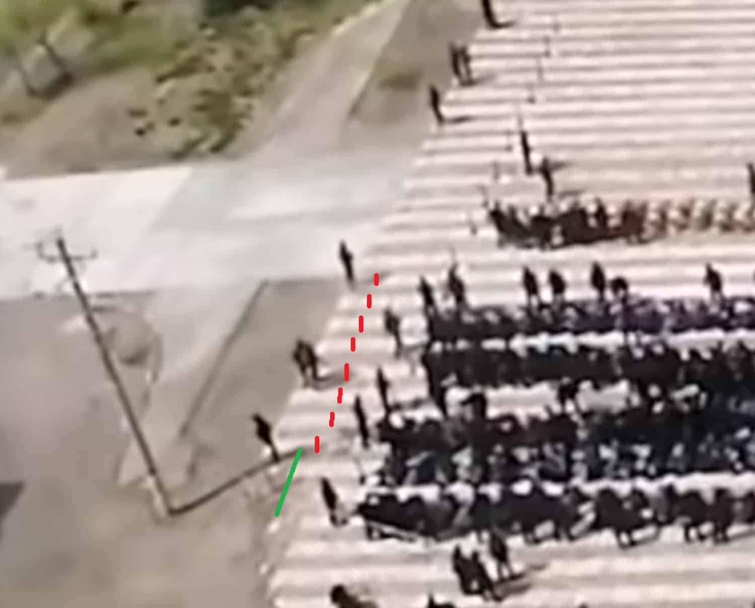 Shadow cast by a telegraph pole, used as a sundial to date the footage.