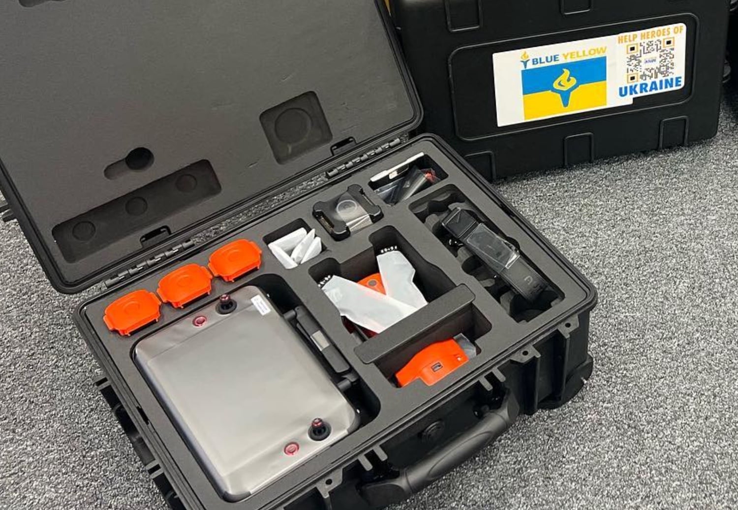 Open hard case holding a thermal drone kit with a Blue-Yellow Ukraine sticker.
