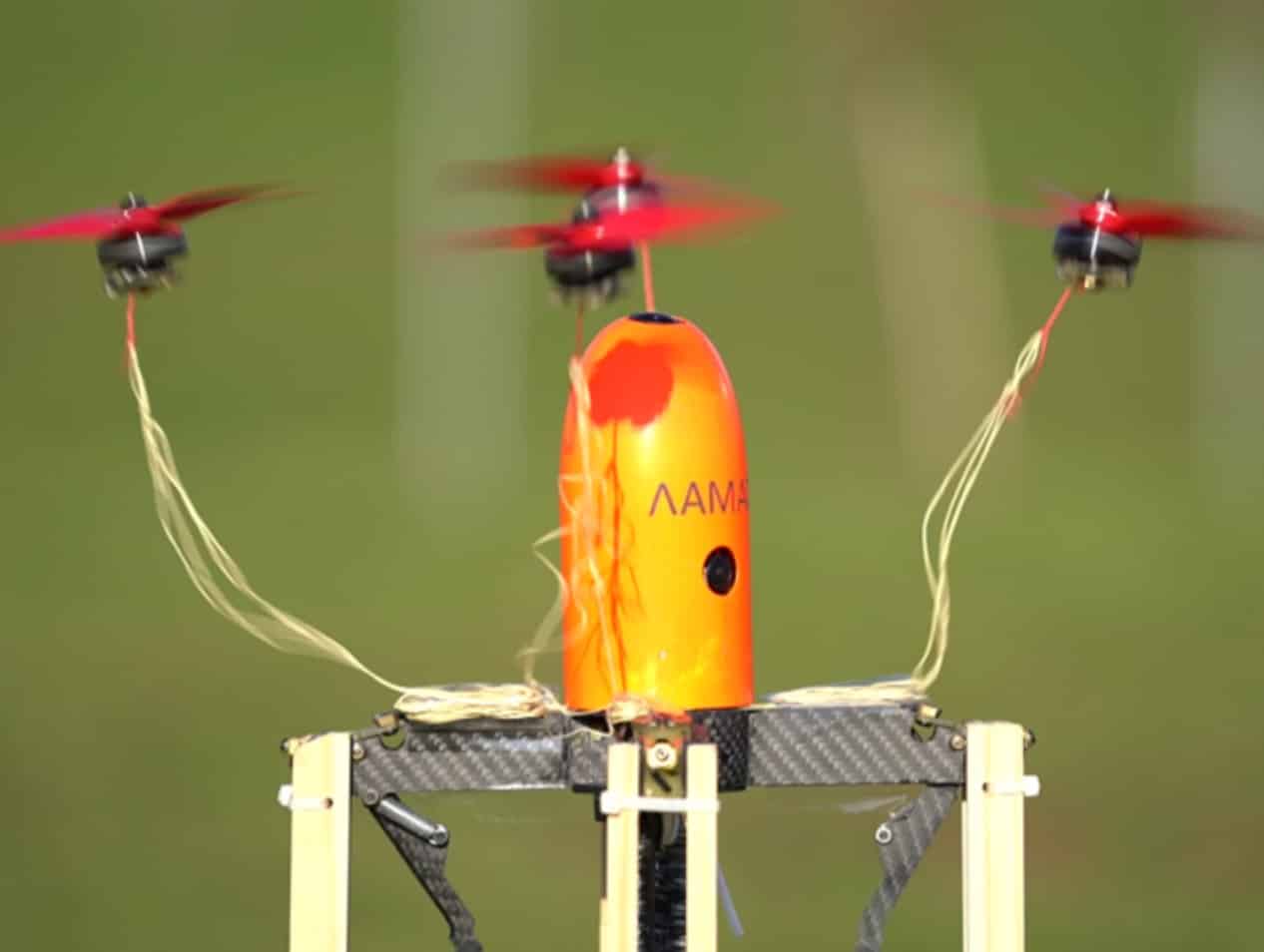 Orange-nosed interceptor lifting off its launch box with net cords trailing behind.