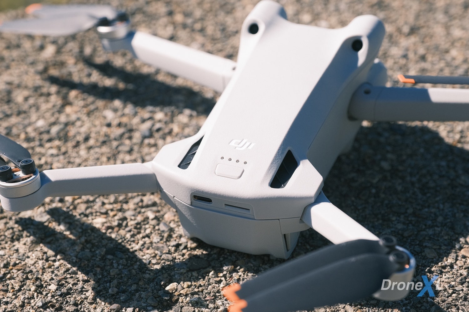 DJI Mini 3 Pro unfolded, showing its tilted body and larger propellers.
