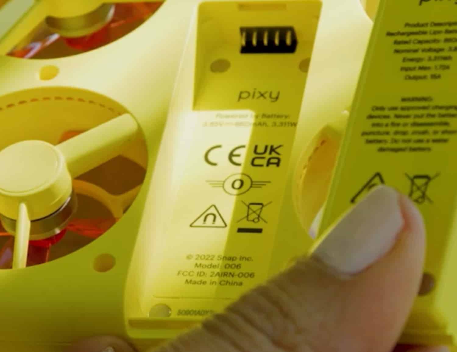 Close-up of the Snap Pixy underside showing CE and UKCA class markings.