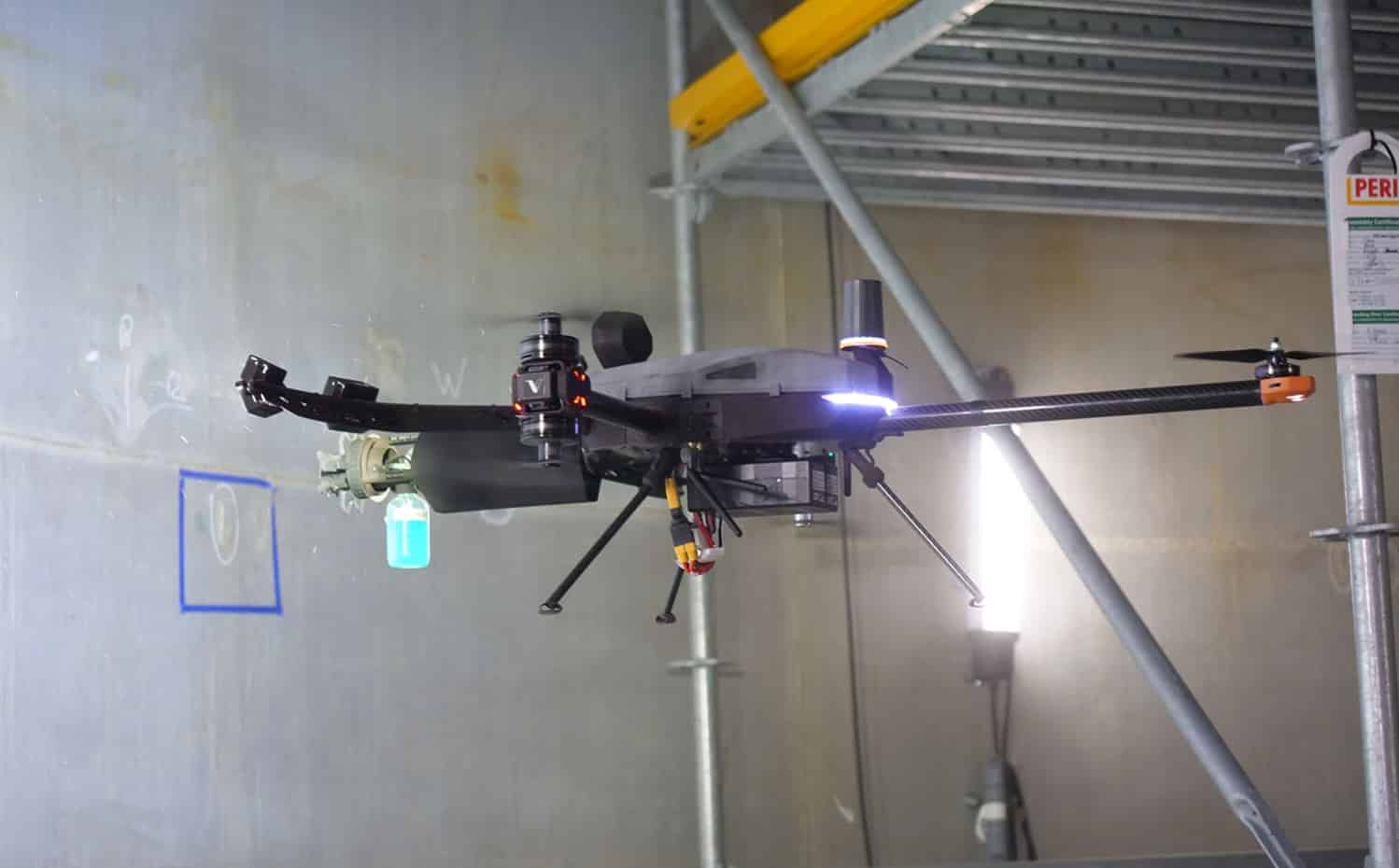 Voliro Airborne Robotics tiltrotor carrying a wall thickness gauge.
